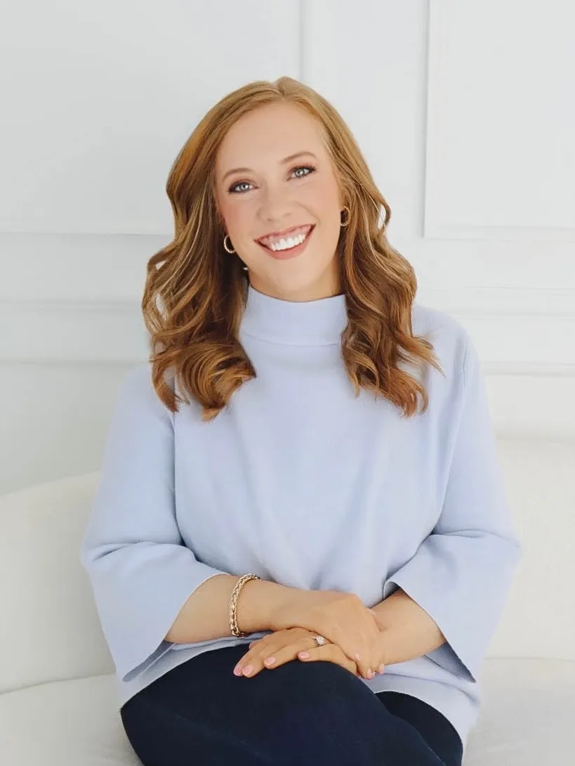 Portrait of Kendra Madewell in a light blue sweater